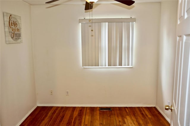 spare room with dark hardwood / wood-style flooring