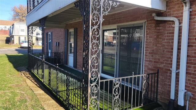 view of side of home with covered porch