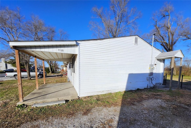 view of property exterior featuring a carport