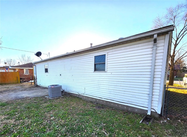 rear view of house with cooling unit