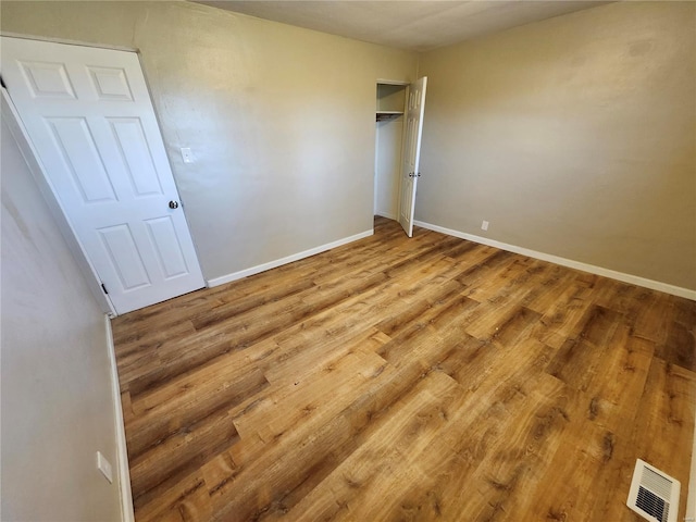 empty room featuring hardwood / wood-style flooring