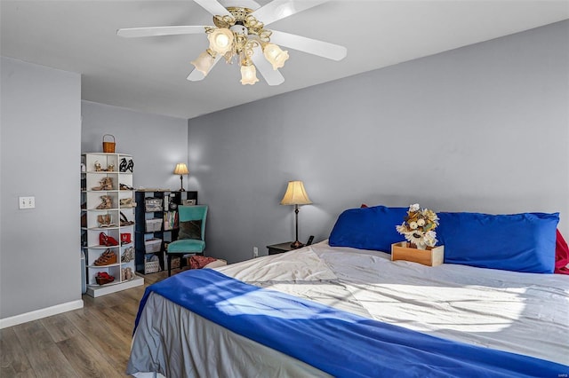 bedroom featuring ceiling fan and hardwood / wood-style flooring