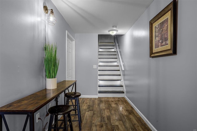 stairway featuring hardwood / wood-style floors