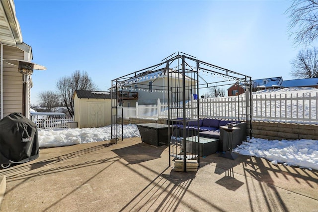 view of patio featuring a gazebo, a storage unit, and outdoor lounge area