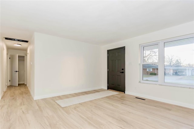 unfurnished room featuring light hardwood / wood-style floors