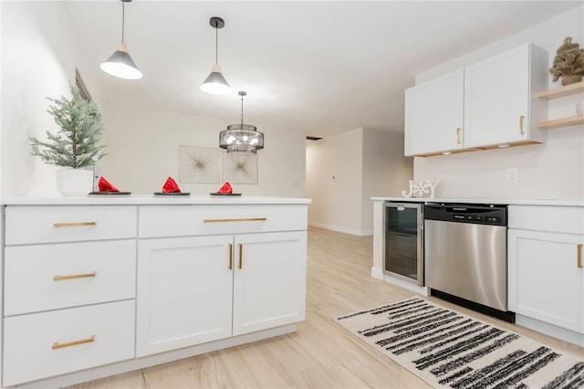 kitchen with pendant lighting, dishwasher, white cabinets, wine cooler, and light hardwood / wood-style floors