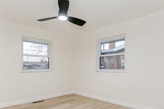 unfurnished room featuring ceiling fan and light hardwood / wood-style floors