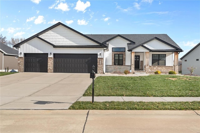 view of front facade with a front yard and a garage