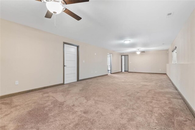 unfurnished room featuring light carpet