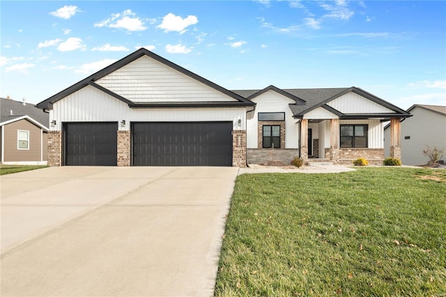 view of front of home with a front lawn and a garage