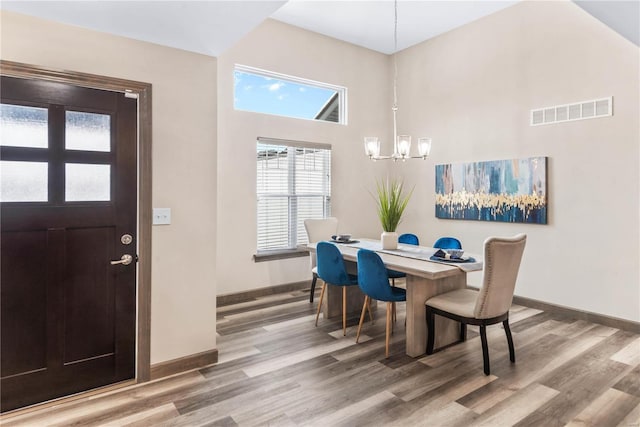 dining area with a chandelier and hardwood / wood-style floors