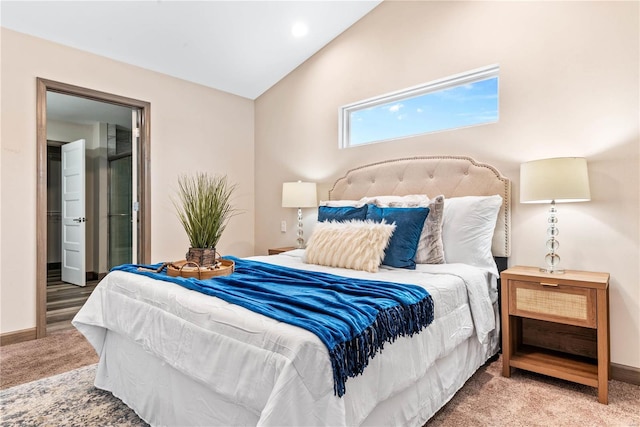 bedroom featuring carpet floors and lofted ceiling