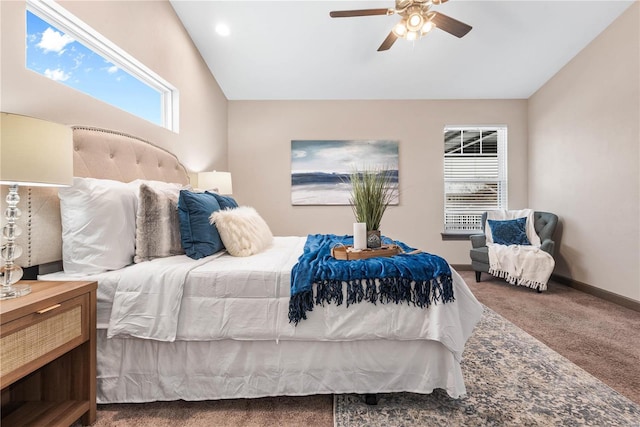 bedroom with ceiling fan, carpet floors, and vaulted ceiling