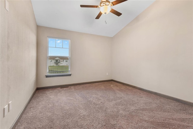 spare room with ceiling fan, carpet floors, and lofted ceiling