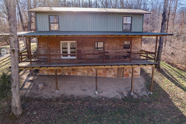 back of house featuring a deck