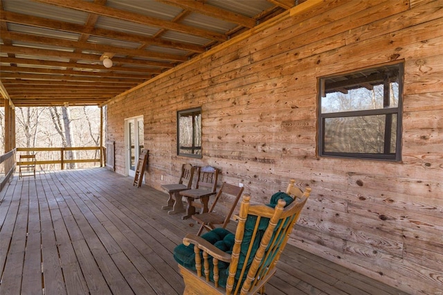 wooden terrace featuring covered porch