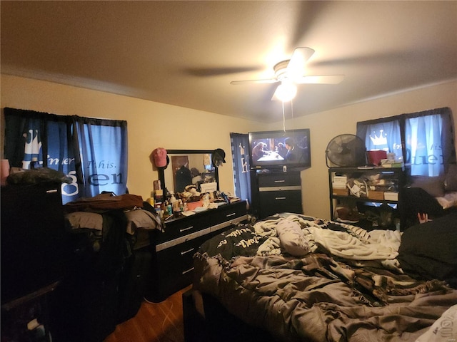 bedroom with wood finished floors and a ceiling fan