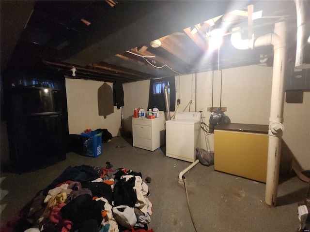 unfinished basement featuring washer and dryer