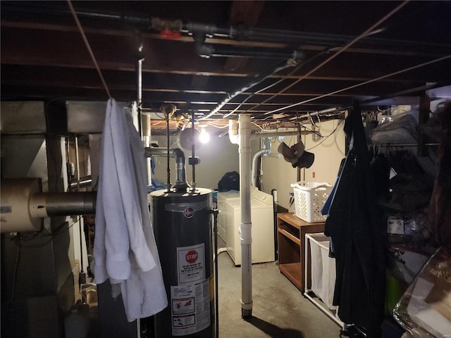 basement with gas water heater and washing machine and clothes dryer