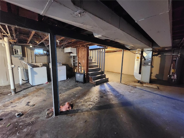 unfinished basement featuring stairway, electric panel, and heating unit