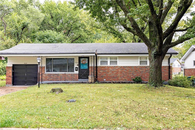 single story home with a garage and a front lawn