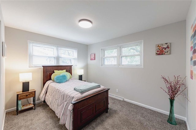 carpeted bedroom with baseboard heating