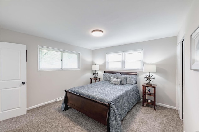 carpeted bedroom with a closet