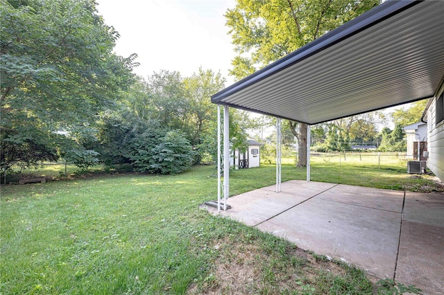 view of yard with a patio area and central air condition unit