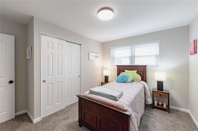 carpeted bedroom featuring a closet