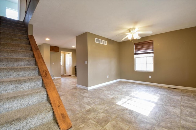 interior space featuring ceiling fan