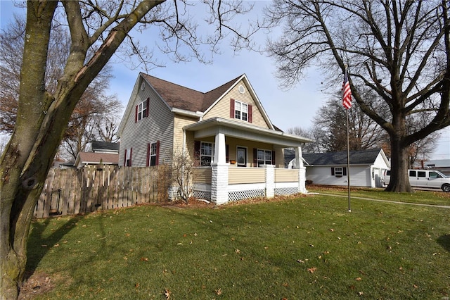 view of front of property with covered porch and a front yard