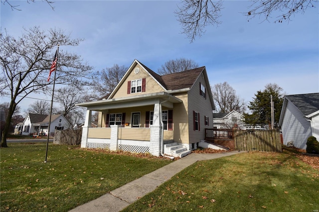 bungalow-style home with a porch and a front yard