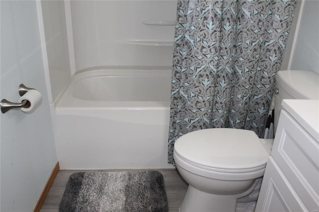 bathroom featuring hardwood / wood-style floors, vanity, toilet, and curtained shower