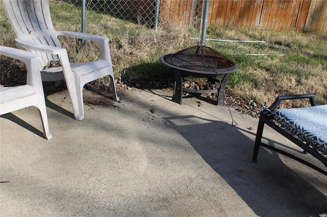 view of patio / terrace featuring an outdoor fire pit