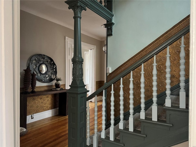 staircase with hardwood / wood-style flooring