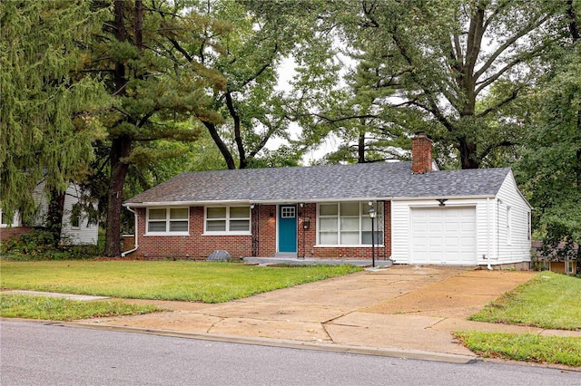 ranch-style house with a garage and a front lawn