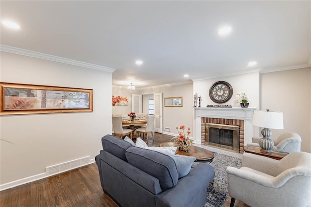 living room featuring a brick fireplace, dark hardwood / wood-style floors, and ornamental molding