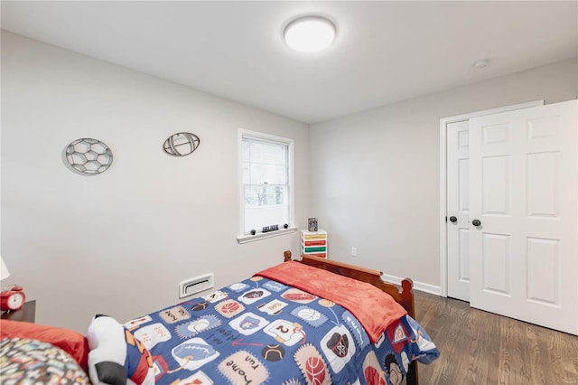 bedroom featuring dark wood-type flooring