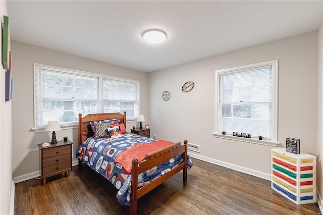 bedroom featuring dark wood-type flooring