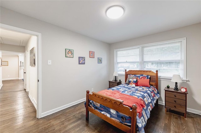 bedroom with hardwood / wood-style floors