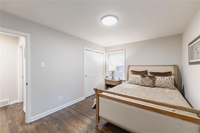 bedroom featuring dark hardwood / wood-style floors and a closet