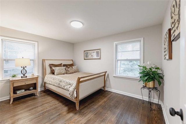 bedroom featuring dark hardwood / wood-style flooring