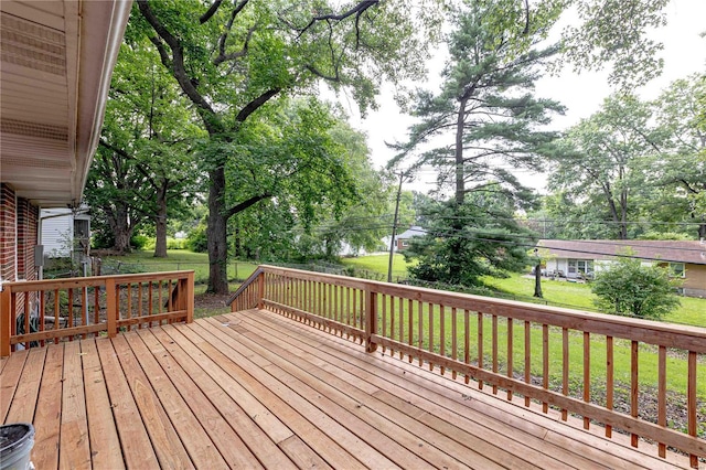 wooden terrace with a yard