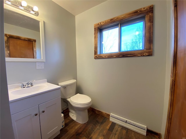 bathroom featuring vanity, hardwood / wood-style flooring, and toilet