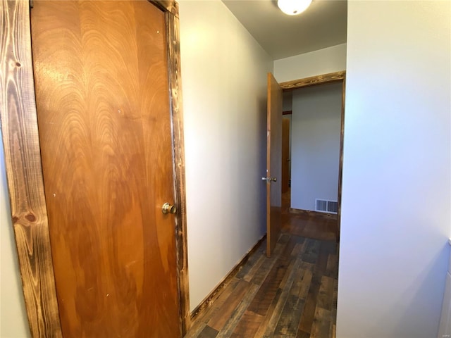 hall with dark hardwood / wood-style floors