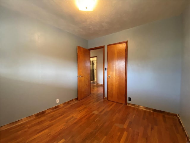 empty room featuring wood-type flooring