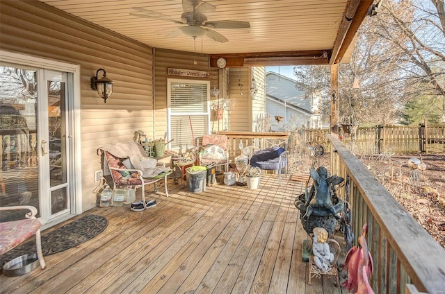 wooden deck featuring ceiling fan