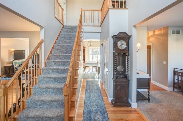 stairway with hardwood / wood-style flooring