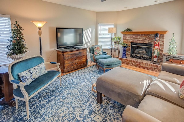 living room with a fireplace and plenty of natural light