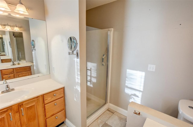 bathroom with tile patterned flooring, vanity, toilet, and an enclosed shower